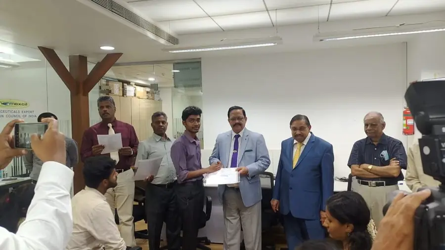 Industrial training participant receiving certificate